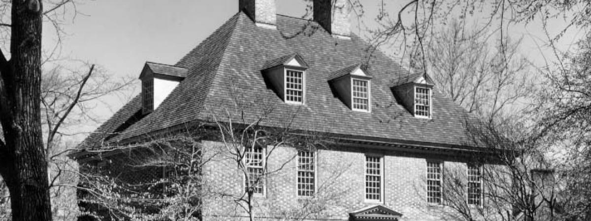 Black and white photo of the three story brick President's House
