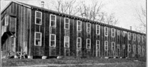 Black and white photo of the two story Penniman Building