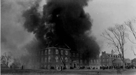 A large cloud of black smoke pours out of Rogers Hall during the 1930 fire
