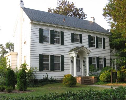 Hoke_House Two story white colonial house with dark shutters