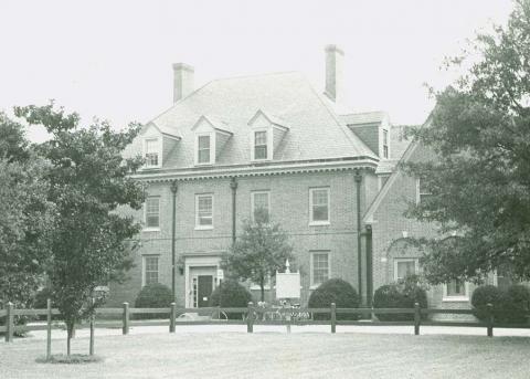 Front facade of the three story brick dorm, facing Jamestown Road