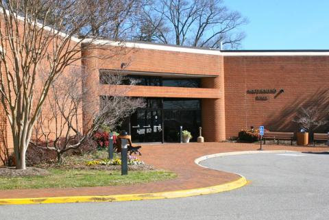 Front entrance to Watermen's hall with circular road in front.