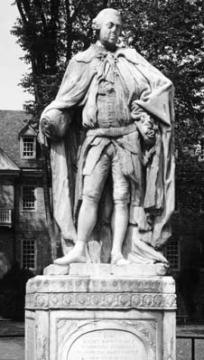 Black and white photo of the Lord Botetourt Statue with the Wren Building in the background