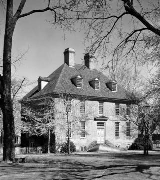 Black and white photo of the three story brick President's House